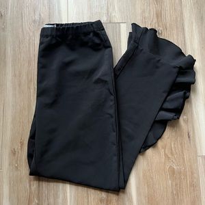 Lilly Edelman adorable black fitted pants with ruffled ankle detail.